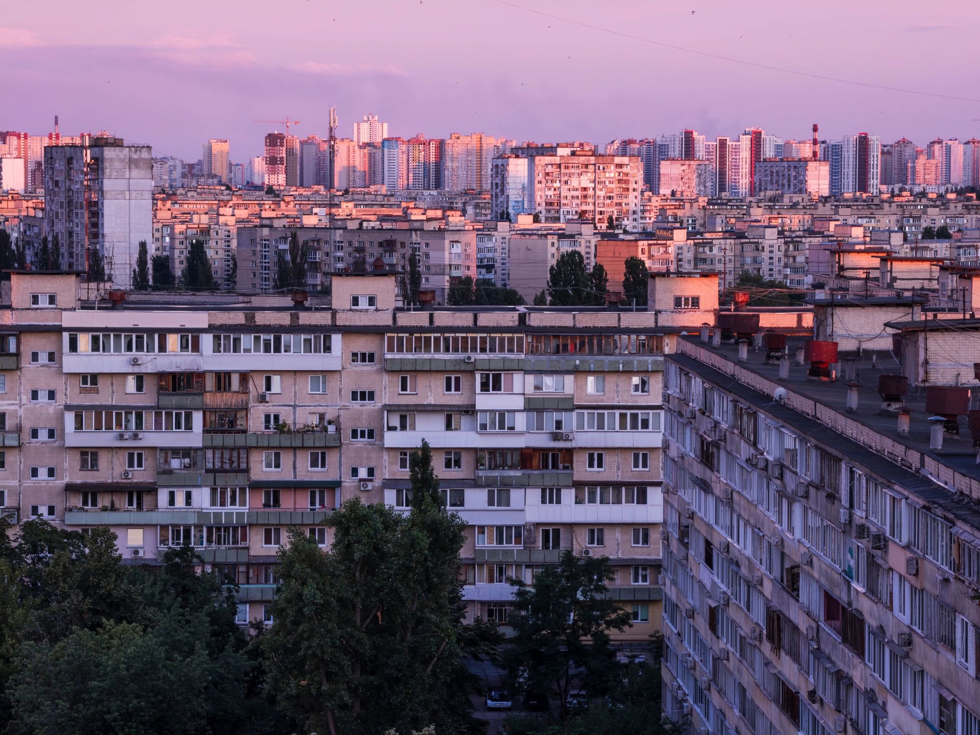 Modern apartment building exterior at dusk